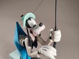 mickey mouse figurine with a fishing pole on a gray background