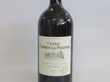 a bottle of wine that is sitting on a table
