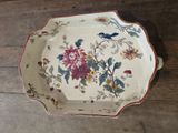 a white plate with a floral design on it