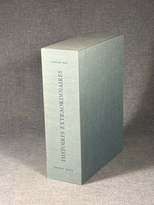 the book is sitting on the table in front of a gray background