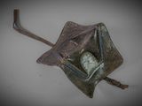a small bag with a heart in it on a table