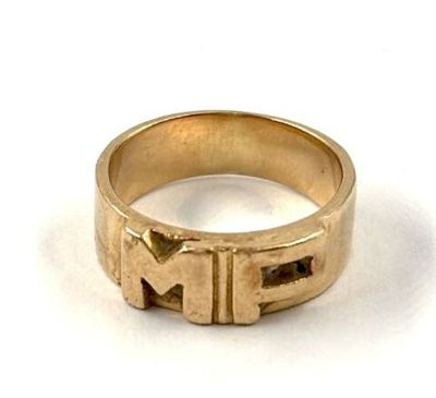 an image of a gold ring with the letter n on it