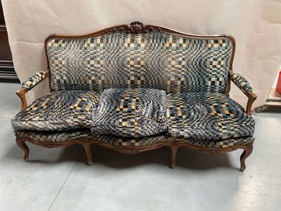 a couch that is sitting on the floor in a room