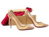 pair of nude colored high heeled shoes in a box on a white background