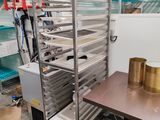 an image of a kitchen with a rack of food on it