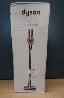 the box of a dysonon cordless vacuum is open on a table