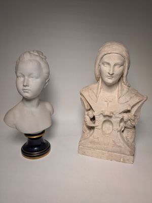 pair of marble busts of a woman and a man