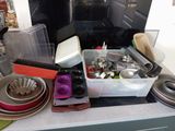 a kitchen counter with a lot of dishes and pans