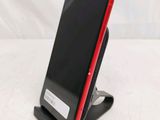 a cell phone that is sitting on a stand