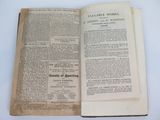 an old book opened to a page with a title on it