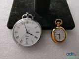 two watches sitting next to each other on a table