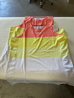 a white table with a yellow and pink shirt on it