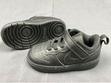 a close up of a pair of baby shoes on a white surface