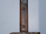 a close up of a knife on a pole