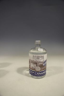 a small bottle of water sitting on a table
