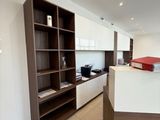 an image of a kitchen with a counter and shelves