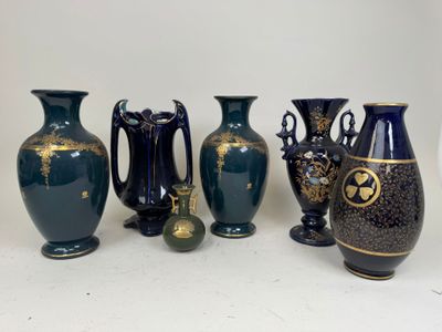 five vases sitting next to each other on a table