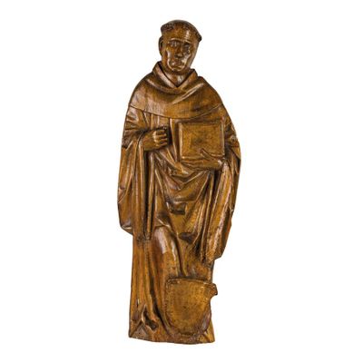 an image of a wooden statue of a man holding a book