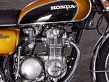 a yellow and black motorcycle parked in a parking lot