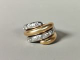 an image of a gold and silver ring with diamonds