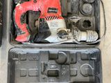 a tool in a case that is sitting on the floor