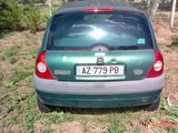 a small car that is parked in the grass