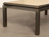 an image of a coffee table with a wooden top on a concrete floor