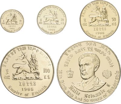 four different types of gold coins with a picture of a man on a horse