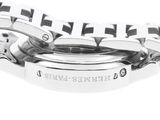a close up of a watch with a black and white checkered band