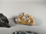 three different types of crystals on a white plate