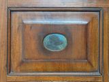 a close up of a wooden door with a metal knob