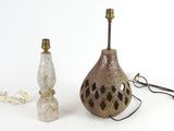two lamps sitting next to each other on a white surface