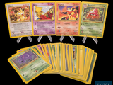 a lot of pokemon cards that are on the table