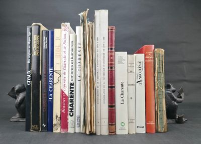 a lot of books that are stacked on top of each other