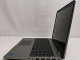 an open laptop computer sitting on top of a white table