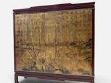 an image of a cabinet with a painting on the door