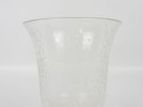 a clear glass vase with white dots on it