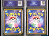 two pokemon trading cards in a clear plastic case on a black background