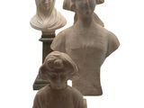 three busturines of women and a man on a pedestal