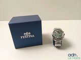 an image of a watch sitting on a table next to a blue box
