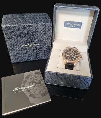 a box with a watch inside of it on a table