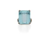 an aqua blue topaze ring with diamonds in 18k white gold