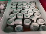 a lot of empty plastic containers sitting on a table