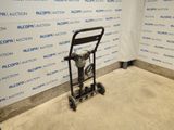 an image of a small hand truck in front of a wall