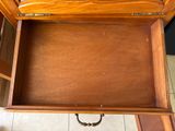 a drawer that has a clock in it