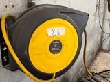 a yellow and black hose attached to a wall
