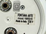 a close up of a white electrical meter on a tiled floor