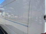a white van that is parked in a lot