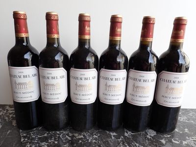 six bottles of wine are lined up on a table