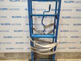 a blue ladder that is sitting in front of a wall